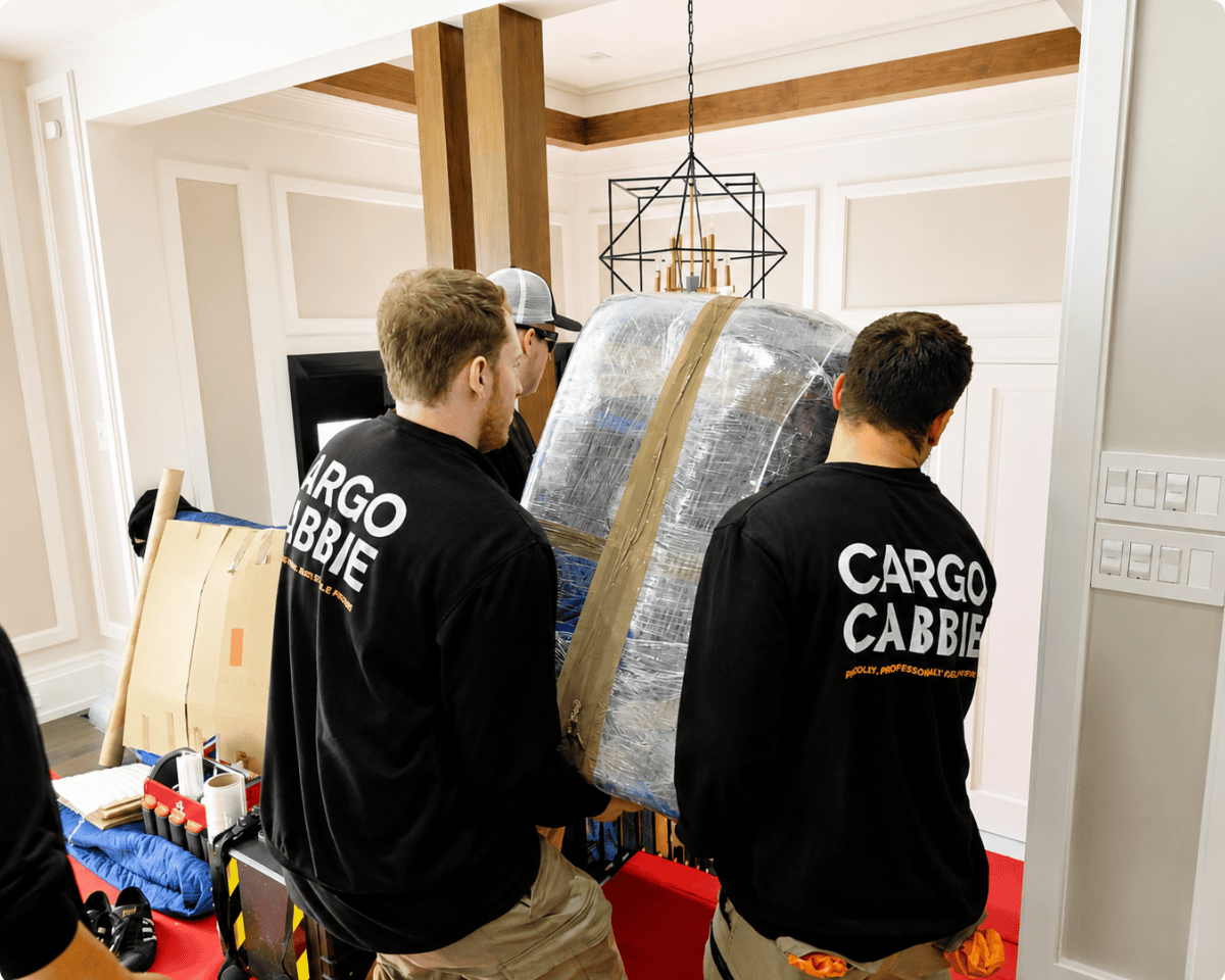 Professional team of CARGO CABBIE movers in uniform
